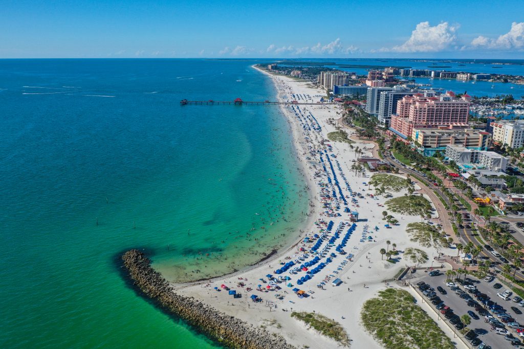 An aerial view of Clearwater Beach, with a view of the fishing pier, hotels, and the Gulf of Mexico