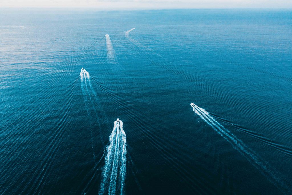 Several sportfishing boats heading offshore for a fishing tournament