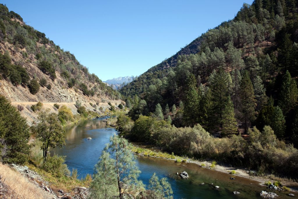 A view of the Trinity River running through the Trinity-Shasta Mountains.
