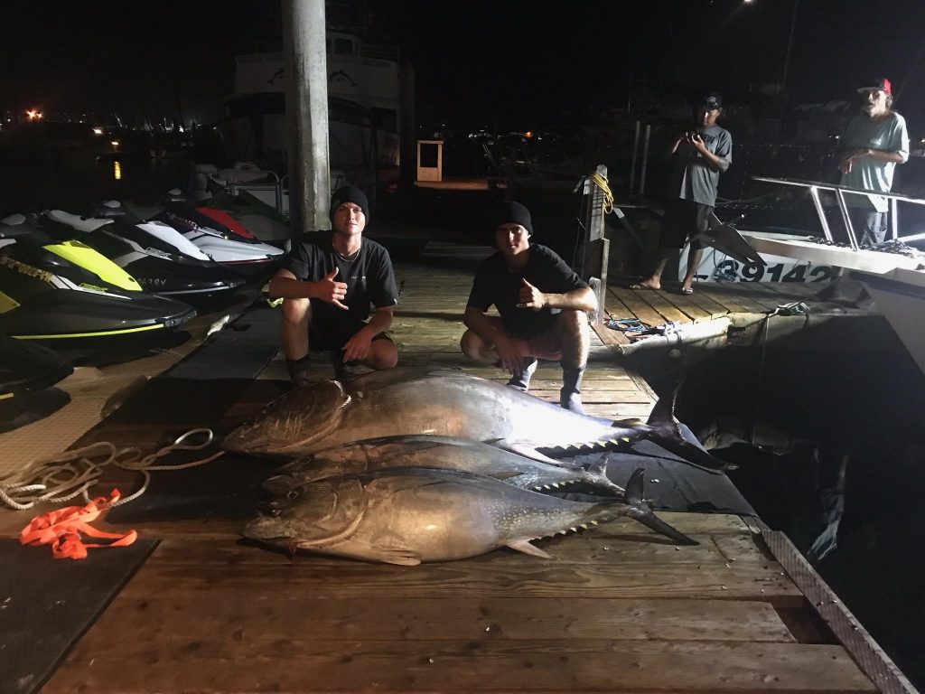 anglers at the dock posing with large Tunas