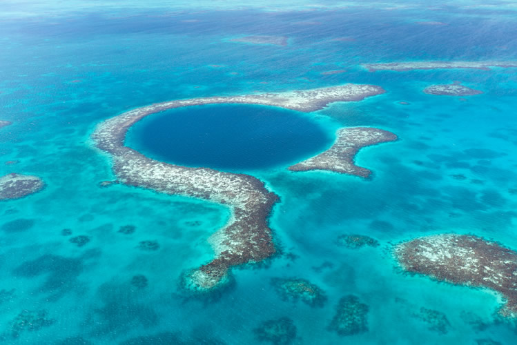 An aerial view of the famous Belize Blue Hole.