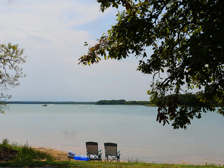 View of a picnic spot, trees, and the waters of Lake Murray.