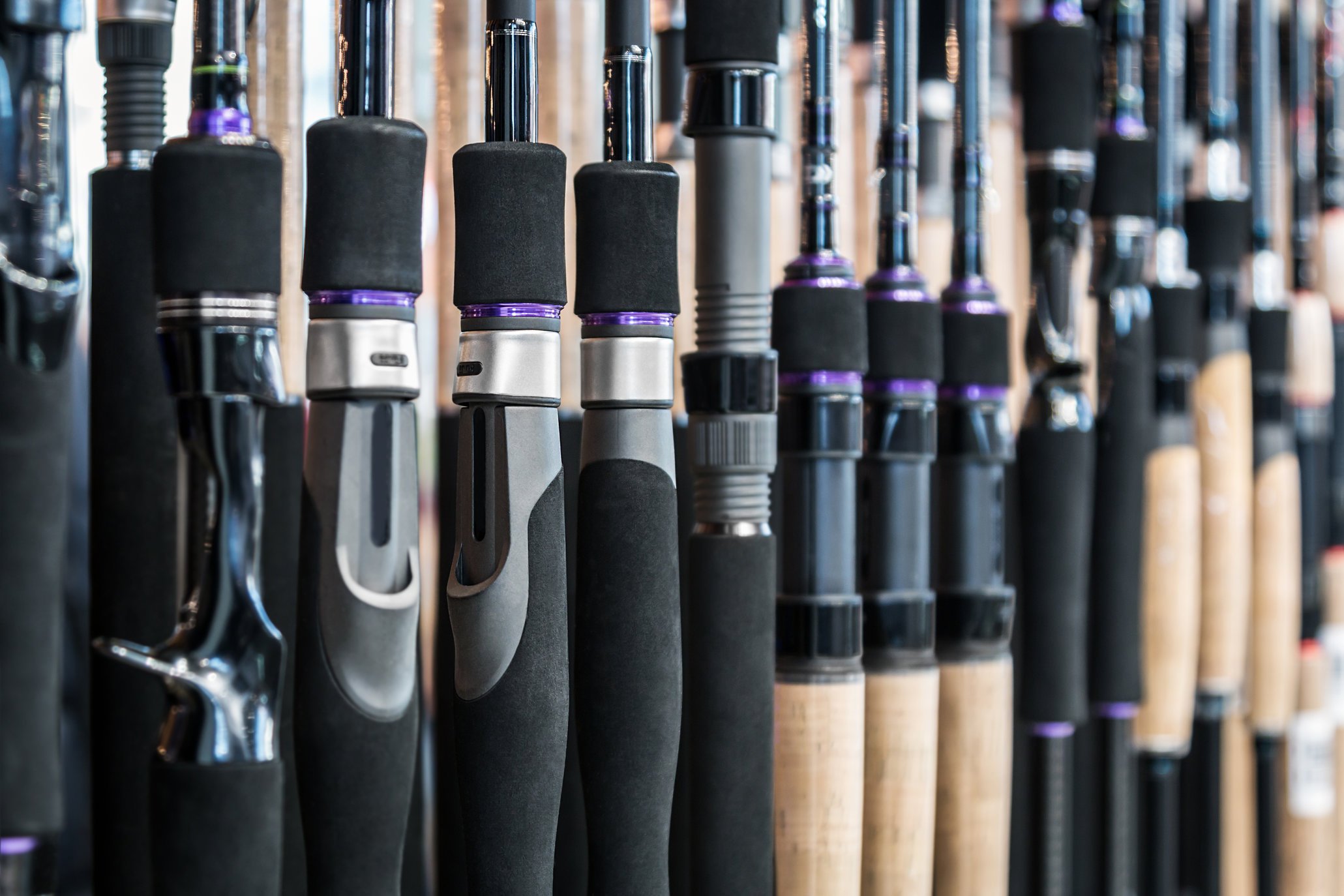 a closeup of a number of rod handles lined up