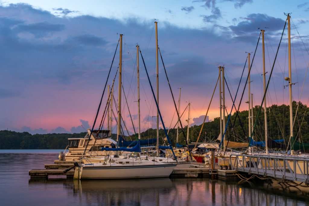A dock with Tennessee river charter boats in Alabama.